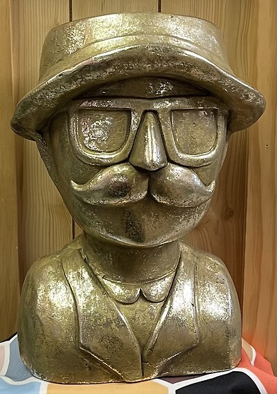 The Monopoly Man Statue Planter